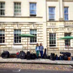 Pattie and Becky waiting outside of the hotel for the tour van with all of our gear.