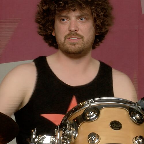 Andrew Gallop, drummer for Rage Again The Machine, performing live with intensity and precision behind the drum kit.